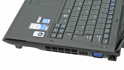 Samsung Q45 laptop showing ports and stickers on keyboard deck.