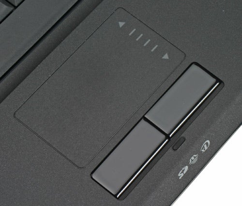 Close-up of Samsung Q45 laptop touchpad and quick launch buttons.