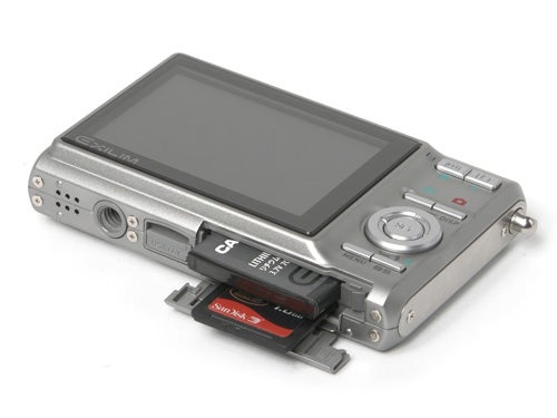 Casio Exilim EX-Z75 camera with open battery compartment.