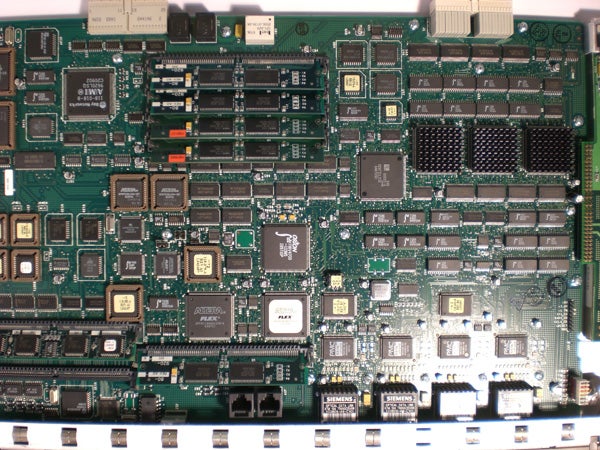 Close-up of a green circuit board with various electronic components.