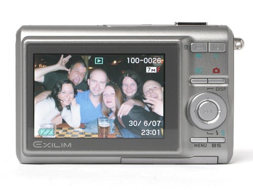 Casio Exilim EX-Z75 camera with a group photo on display.