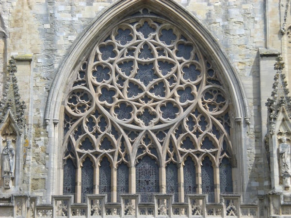 Detailed photo of Gothic cathedral window architecture.