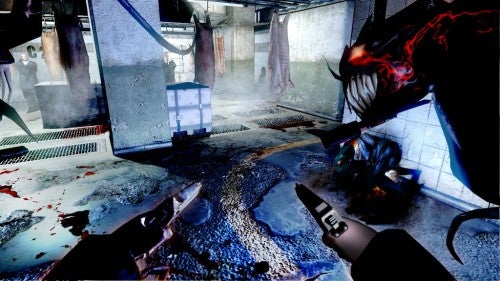 Screenshot from The Darkness video game showing combat scene.
