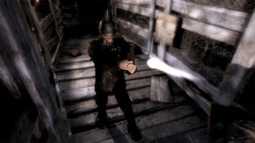 Screenshot of The Darkness game with character wielding power.
