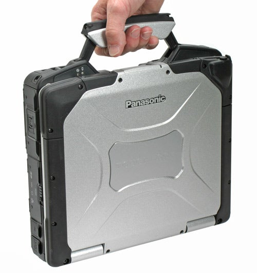 Hand holding a Panasonic ToughBook CF-30 Rugged Notebook.