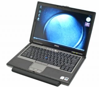 Dell Latitude D630 laptop open and powered on.