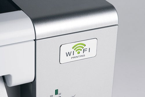 Close-up of Lexmark X4550 printer with Wi-Fi printing logo.