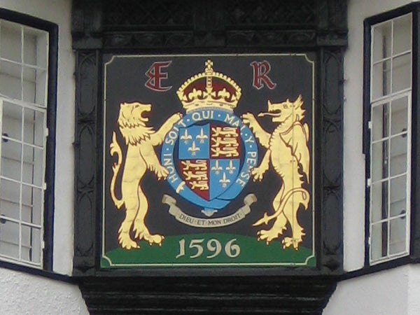 Heraldic plaque with lions and a crown, dated 1596.