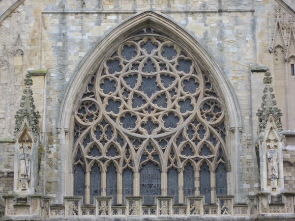 Intricate gothic church window architecture captured by a camera.