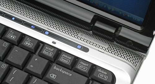 Close-up of HP Pavilion dv2560ea laptop keyboard and power button.