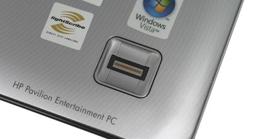 Close-up of HP Pavilion dv2560ea laptop's lid and logo.