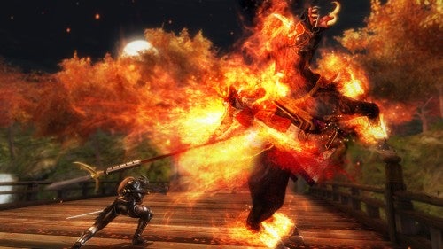 Ninja Gaiden Sigma gameplay showing fiery battle scene.