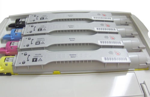 Xerox Phaser 6360VN color toner cartridges on printer tray.