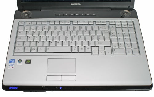 Toshiba Satellite P200-143 laptop with open lid showing keyboard.