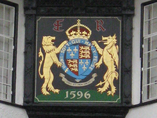 Coat of arms plaque on building facade from 1596.