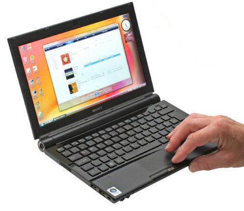 Sony VAIO VGN-TZ12VN laptop with hand on touchpad.