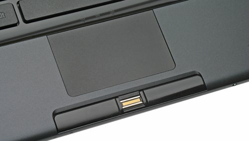 Close-up of Sony VAIO VGN-TZ12VN laptop's touchpad and fingerprint sensor.