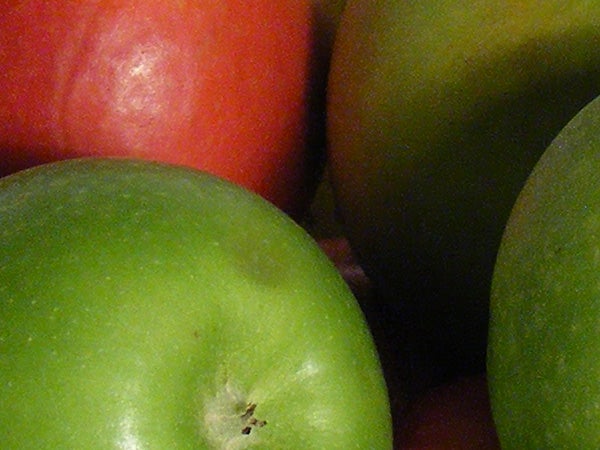 Close-up photo of green and red apples.