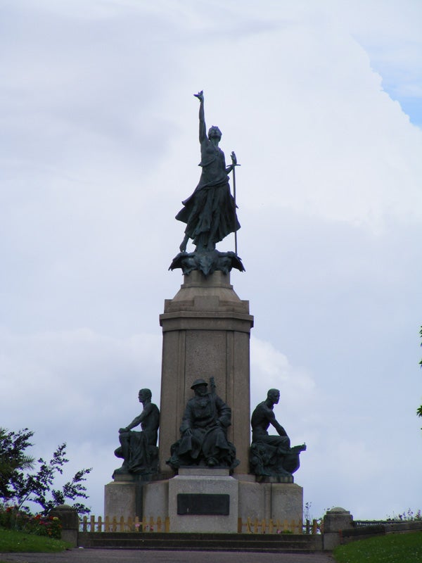 Statue of a historical figure with a raised sword
