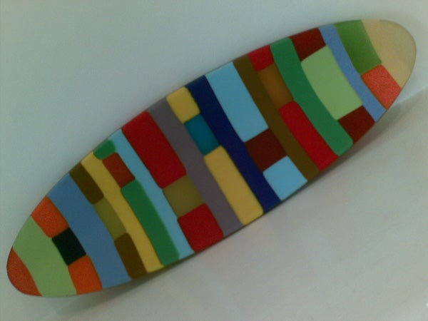 Colorful pattern on a surfboard-shaped object.