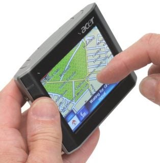 Person holding an Acer V200 series portable GPS navigator.