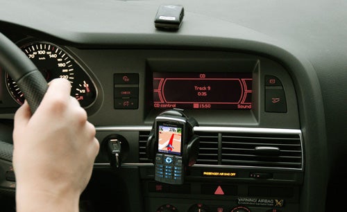 Car dashboard with Wayfinder Navigator 7 GPS device.