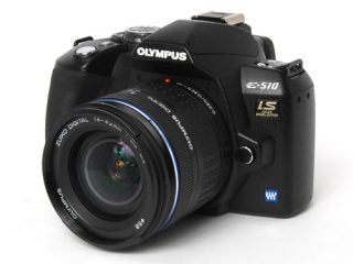 Olympus E-510 Digital SLR camera with lens on white background.