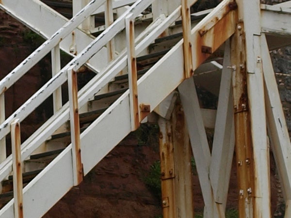 Close-up of rusty staircase, showcasing camera's detail capture.