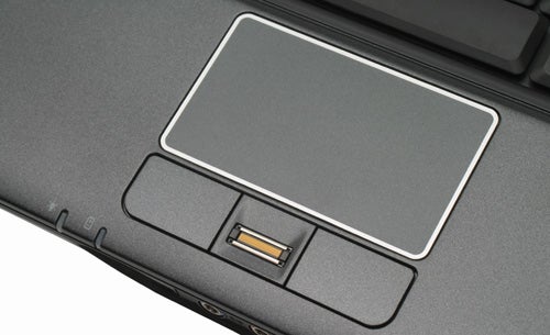 Close-up of Acer TravelMate 6292 laptop touchpad and fingerprint reader.