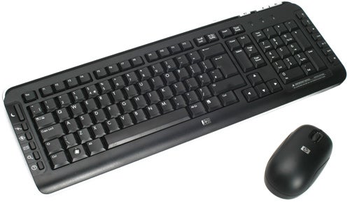 HP Pavilion wireless keyboard and mouse set on white surface.