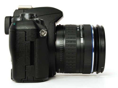 Olympus E-410 DSLR camera with lens on white background.