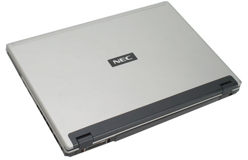 Closed NEC Versa S970 laptop on white background.