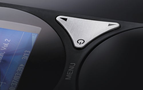 Close-up of TrekStor Vibez MP3 player menu button and interface.