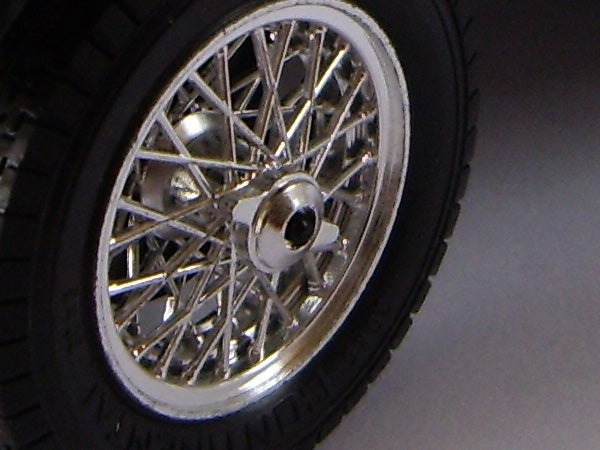 Close-up of a motorcycle wheel with spoke design.