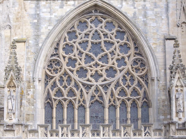 Photo of intricate gothic church window architecture.
