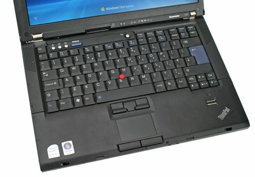 Lenovo ThinkPad T61 laptop with keyboard and trackpoint visible.