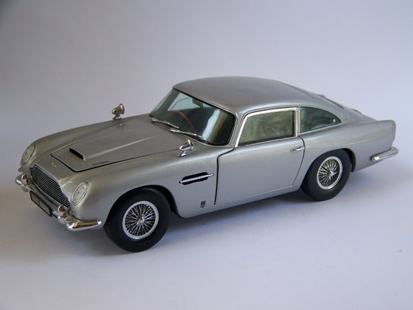 Scale model of silver Aston Martin classic car