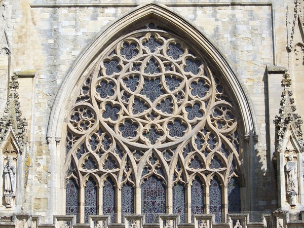Detailed gothic window architecture of a cathedral.
