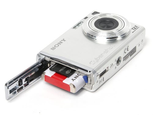Sony Cyber-shot DSC-W200 camera with open battery compartment.