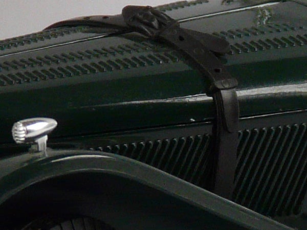 Close-up of a camera's texture detail and strap.