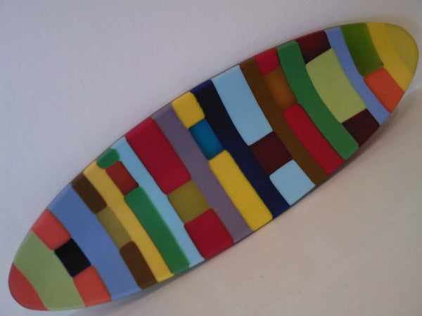 Colorful surfboard on a white background