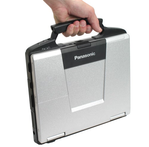 Person holding a Panasonic ToughBook CF-74 by the handle.