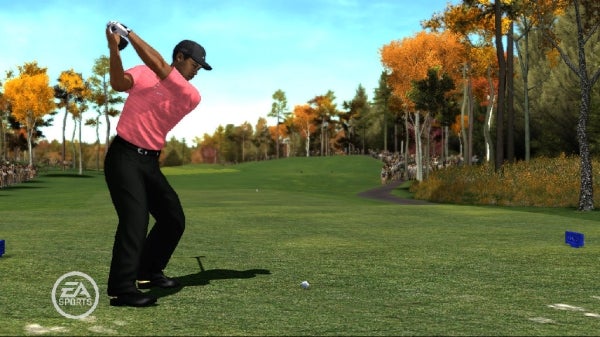 Golfer swinging at ball in Tiger Woods PGA Tour 08 game.