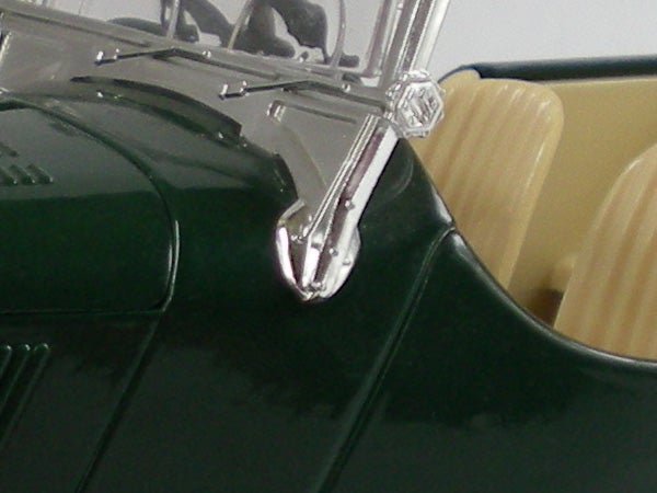 Close-up of a green Nikon CoolPix S200 camera corner.