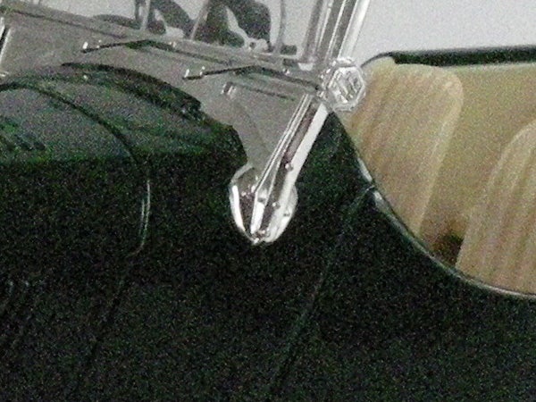 Close-up of a black camera bag’s zipper detail.