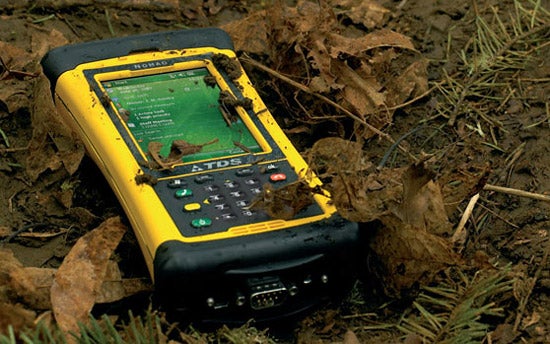 TDS Nomad 800L Rugged PDA lying in the dirt.