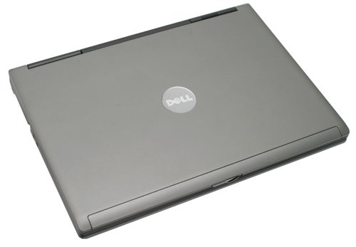 Dell Latitude D531 laptop closed on a gray surface.