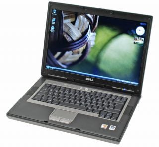 Dell Latitude D531 laptop open with a screen displaying wallpaper