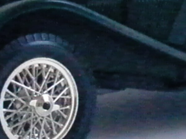 Close-up of a car wheel with spokes.