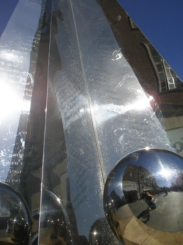 Reflective monument and distorted reflections of surroundings.